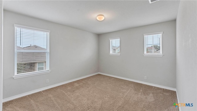 unfurnished room featuring carpet