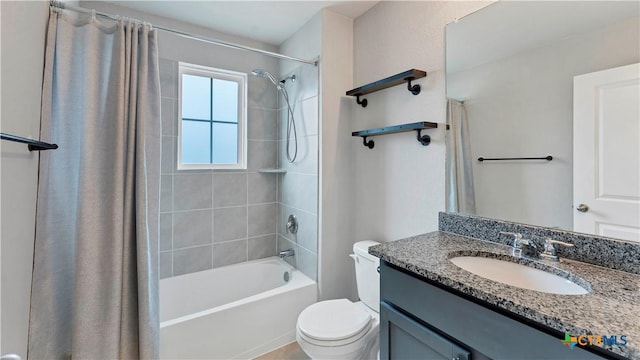 full bathroom featuring toilet, shower / tub combo, and vanity