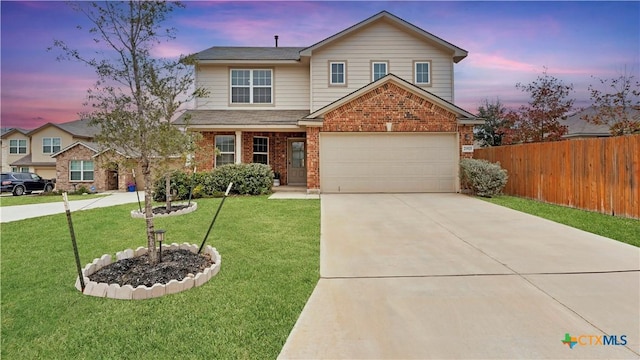 front facade with a lawn and a garage