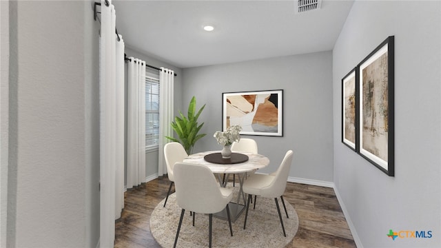 dining room with dark wood-type flooring