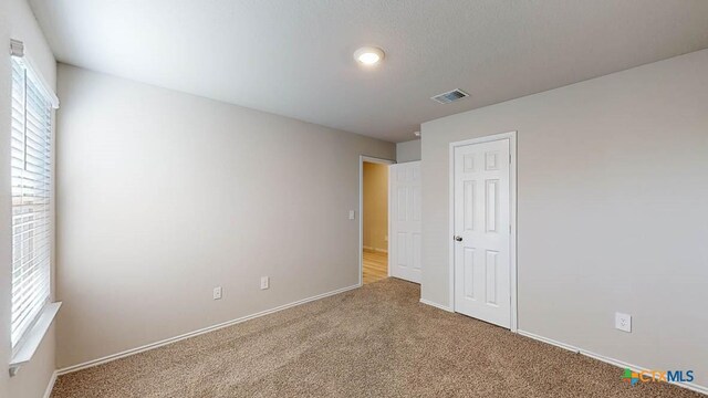 1329 Piedmont St, Temple, TX 76504 - unfurnished bedroom featuring carpet floors, baseboards, and a closet