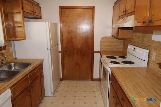 kitchen with white appliances and sink