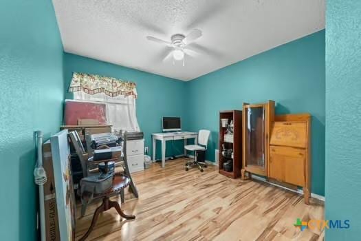 2303 Schwald Rd, Killeen, TX 76543 - office featuring a ceiling fan, wood finished floors, a textured wall, and a textured ceiling