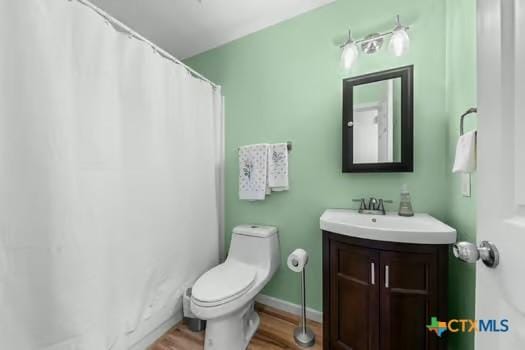 2303 Schwald Rd, Killeen, TX 76543 - bathroom featuring wood finished floors, vanity, and toilet
