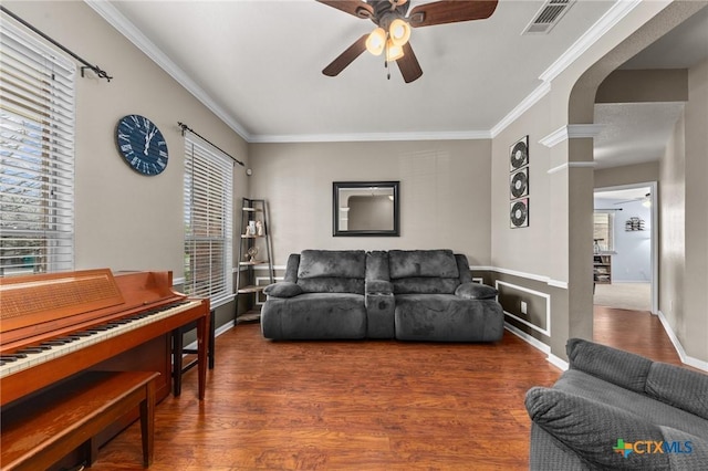 103 Lone Shadow Dr, Harker Heights, TX 76548 - living area featuring a ceiling fan, wood finished floors, ornamental molding, arched walkways, and decorative columns
