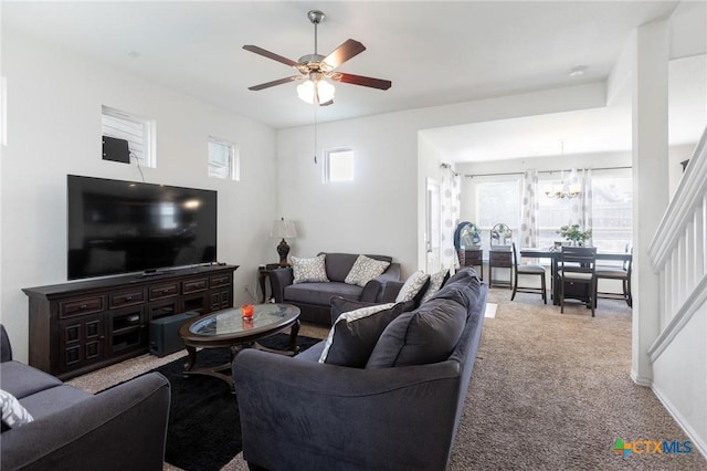 263 Joseph Dr, Buda, TX 78610 - living room featuring a ceiling fan, plenty of natural light, carpet floors, and a chandelier