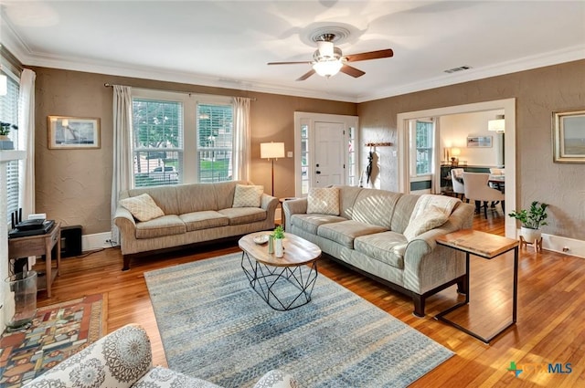 406 S Liberty St, Victoria, TX 77901 - living area featuring visible vents, light wood finished floors, plenty of natural light, and a ceiling fan