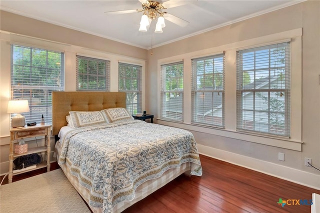 406 S Liberty St, Victoria, TX 77901 - bedroom with multiple windows, baseboards, ornamental molding, and wood finished floors