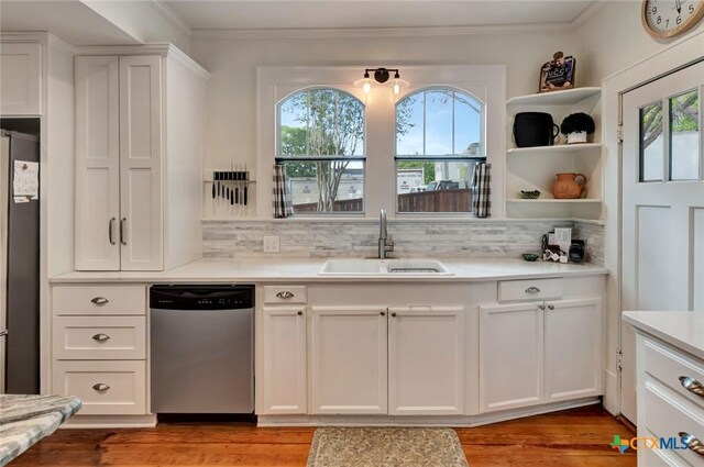 406 S Liberty St, Victoria, TX 77901 - kitchen with a sink, stainless steel dishwasher, refrigerator, and a healthy amount of sunlight