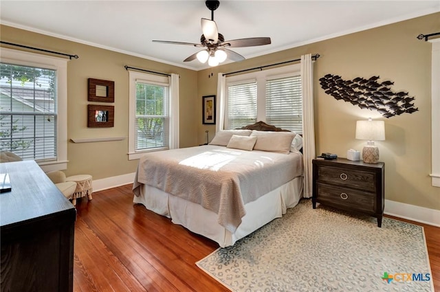 406 S Liberty St, Victoria, TX 77901 - bedroom featuring crown molding, baseboards, a ceiling fan, and wood finished floors