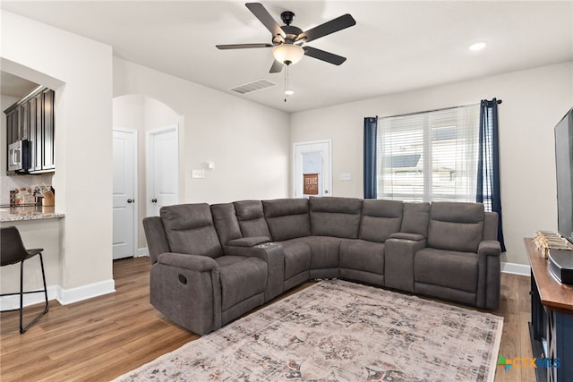 5712 Red Fish Ct, Belton, TX 76513 - living area with arched walkways, wood finished floors, a ceiling fan, baseboards, and recessed lighting