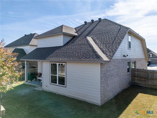5712 Red Fish Ct, Belton, TX 76513 - view of side of property featuring a shingled roof and brick siding