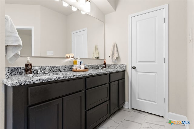5712 Red Fish Ct, Belton, TX 76513 - full bathroom with marble look tile flooring, double vanity, and baseboards