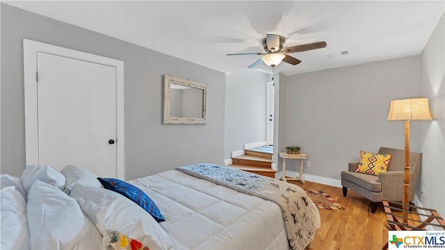 bedroom featuring hardwood / wood-style flooring and ceiling fan