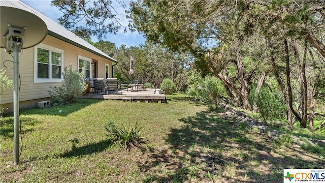 view of yard with a wooden deck