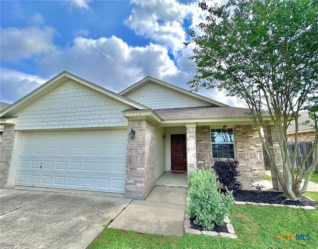 214 Yellowstone Dr, Victoria, TX 77904 - single story home with a garage, driveway, and brick siding