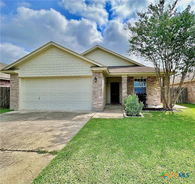 214 Yellowstone Dr, Victoria, TX 77904 - ranch-style house with driveway, a garage, and brick siding