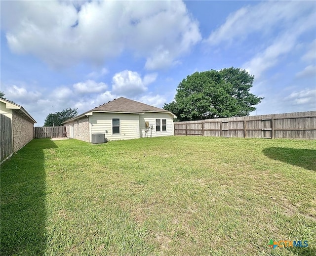 214 Yellowstone Dr, Victoria, TX 77904 - back of property with central AC unit