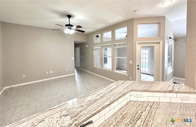 214 Yellowstone Dr, Victoria, TX 77904 - unfurnished living room featuring ceiling fan and baseboards