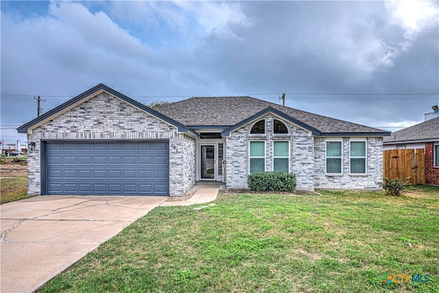 ranch-style house with a front yard and a garage