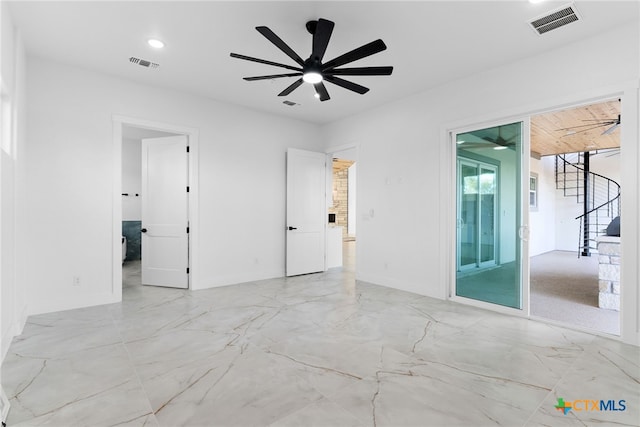 unfurnished room featuring ceiling fan