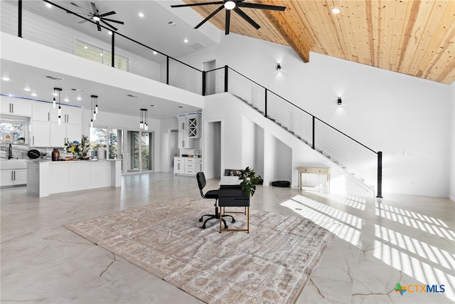 interior space with high vaulted ceiling, ceiling fan, beam ceiling, and wood ceiling