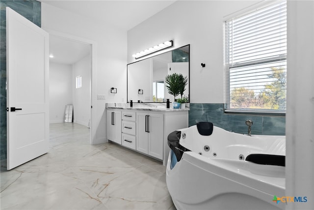 bathroom with vanity and a bathing tub