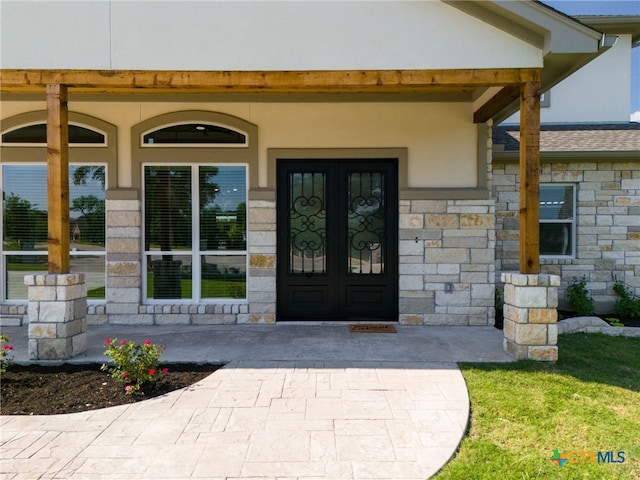 entrance to property featuring french doors