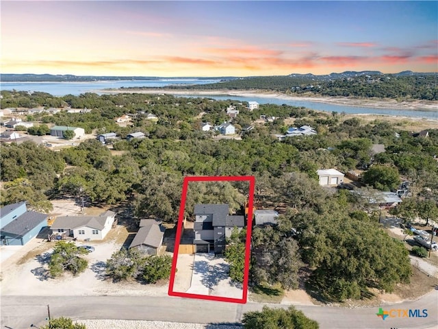 aerial view featuring a water view and a residential view