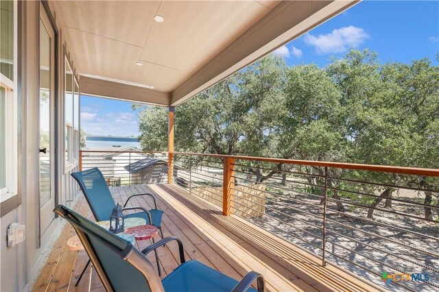 wooden terrace with a water view