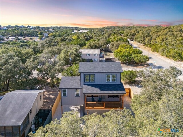 aerial view featuring a view of trees