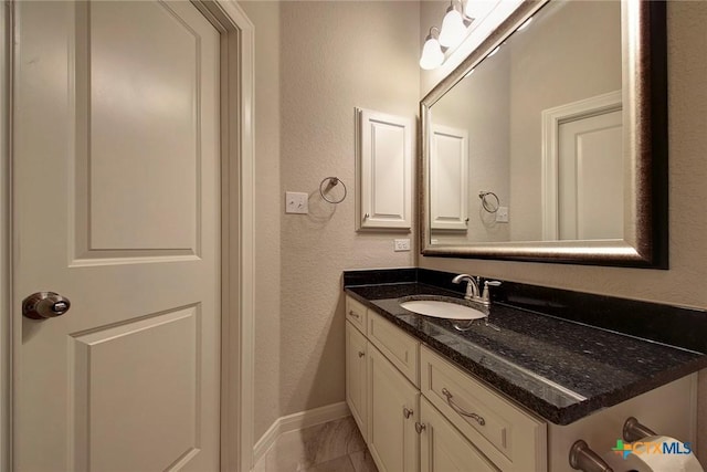 bathroom with tile patterned flooring and vanity