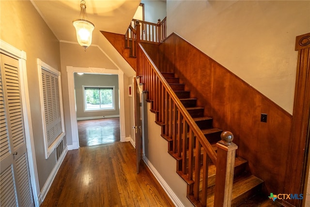 stairway featuring wood-type flooring