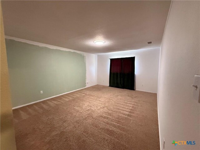 3054 Colorado Dr, Copperas Cove, TX 76522 - spare room featuring carpet flooring and ornamental molding