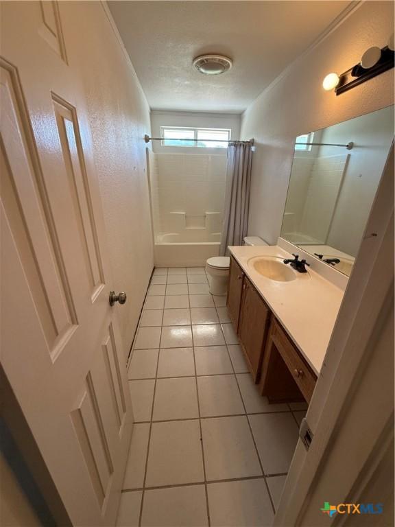3054 Colorado Dr, Copperas Cove, TX 76522 - bathroom with vanity, shower / tub combo with curtain, and tile patterned floors
