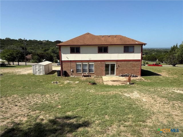 3054 Colorado Dr, Copperas Cove, TX 76522 - rear view of house featuring a storage unit, a patio area, a yard, and brick siding