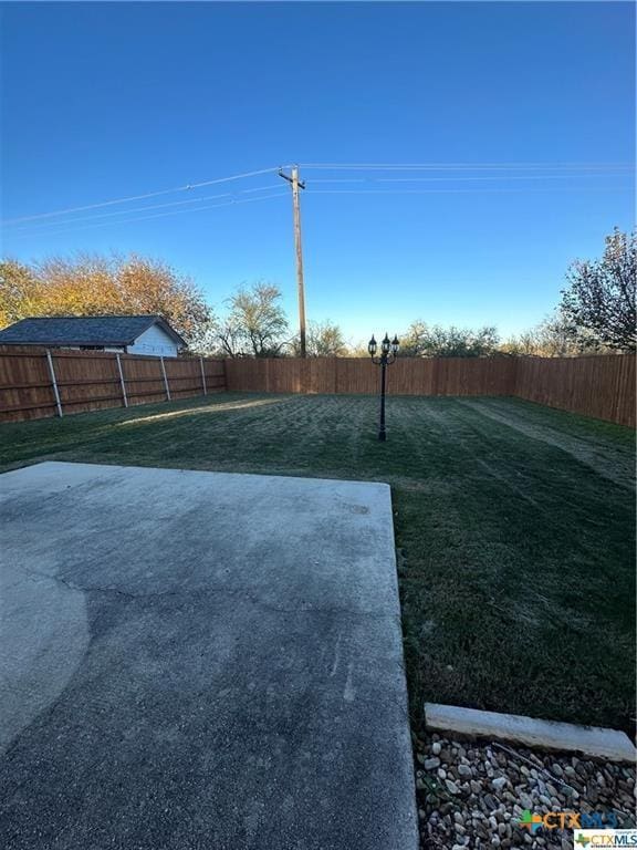 view of yard featuring a fenced backyard