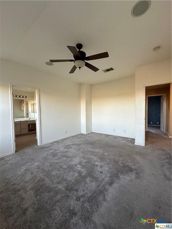 unfurnished bedroom featuring baseboards, visible vents, and carpet