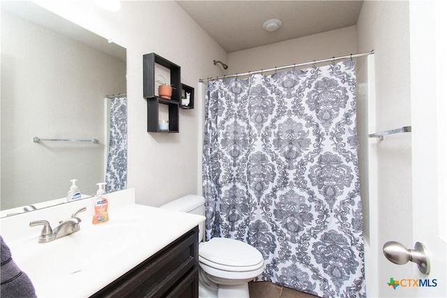 full bathroom with toilet, vanity, and a shower with shower curtain