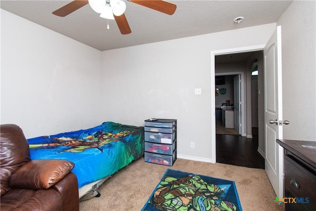 carpeted bedroom with baseboards and ceiling fan