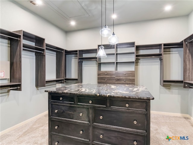 walk in closet featuring carpet floors