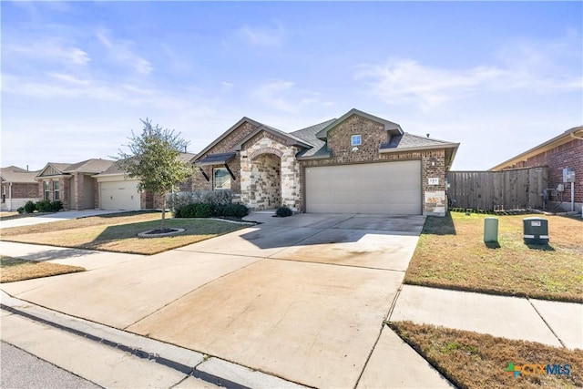 view of front facade with a front yard and a garage