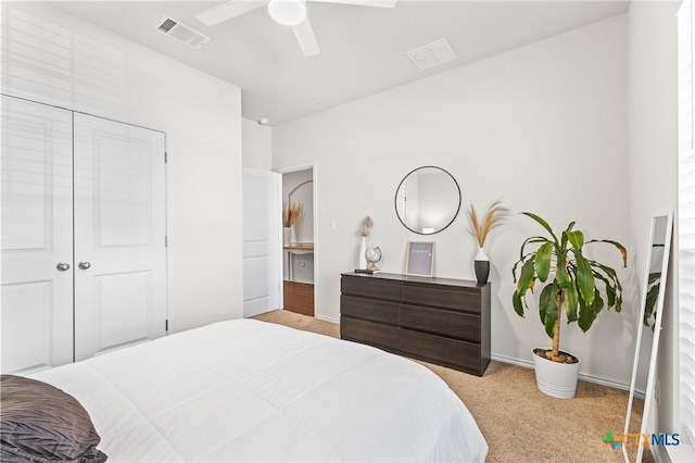 carpeted bedroom with ceiling fan and a closet