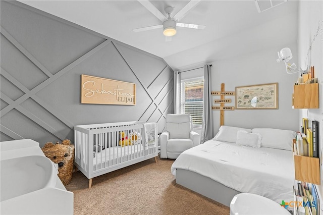 bedroom featuring ceiling fan, carpet floors, and lofted ceiling