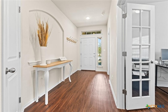 foyer entrance with dark hardwood / wood-style flooring