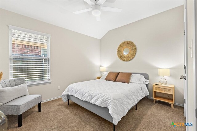 bedroom with lofted ceiling, ceiling fan, and carpet