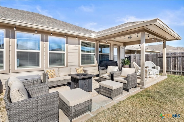 view of patio / terrace featuring an outdoor living space with a fire pit