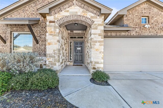 property entrance with a garage