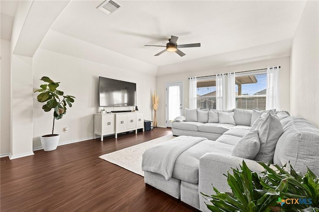 living room with ceiling fan and dark hardwood / wood-style floors