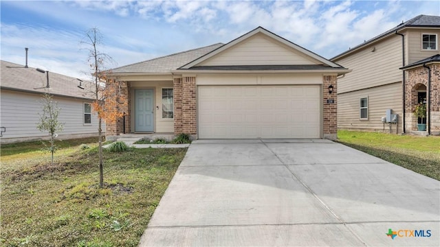 single story home featuring a garage and a front lawn